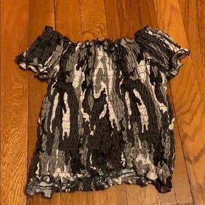 A cropped shirt that has never been worn.